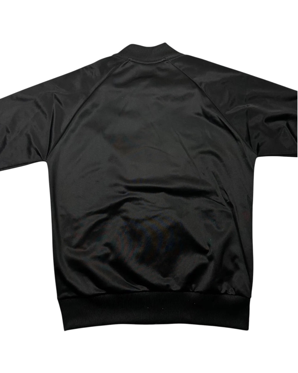Casual Circuit. Fred Perry argyle track jacket, black, polyester, with a full-length zip and ribbed cuffs.