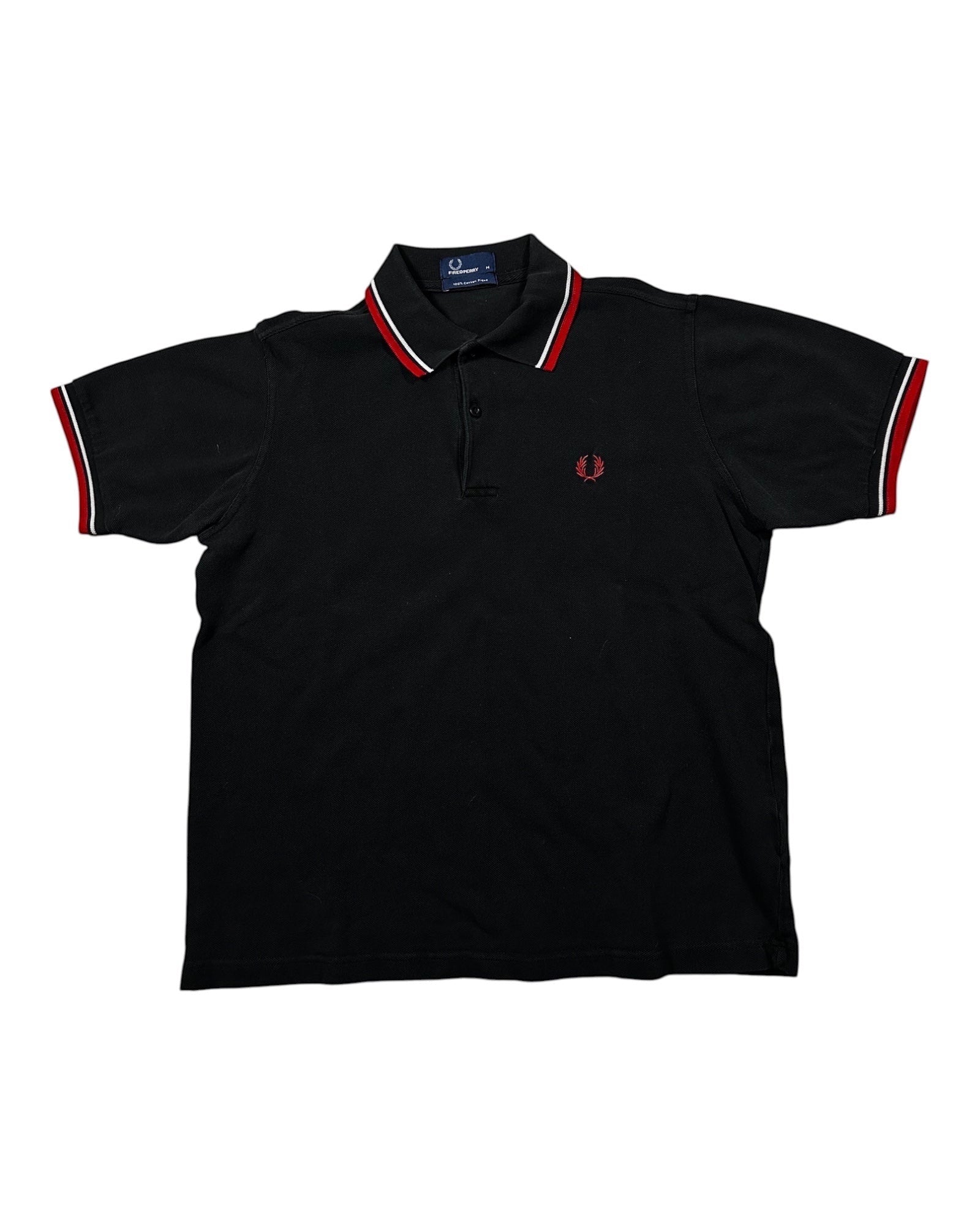 Casual Circuit. Black men's cotton polo shirt with red and white contrast stripes on the collar and sleeves, Fred Perry logo.