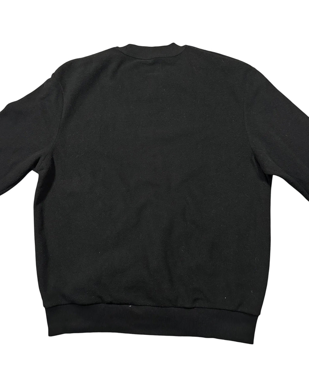 Casual Circuit. Black Fred Perry jumper with a laurel wreath logo, crew neck and ribbed cuffs.