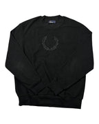 Casual Circuit. Black Fred Perry jumper with a laurel wreath logo on the chest, crew neck and ribbed cuffs.