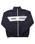 Casual Circuit. Navy windbreaker with a white stripe and Fred Perry lettering, colourful laurel wreaths on the chest.