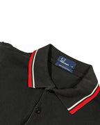 Casual Circuit. Black men's cotton polo shirt with red and white contrast stripes on the collar and sleeves.